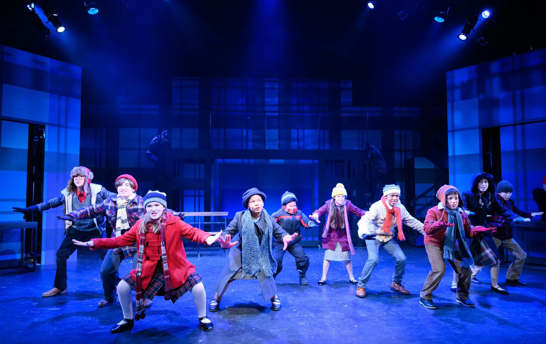 The youth ensemble performing a winter musical number in A Christmas Story.