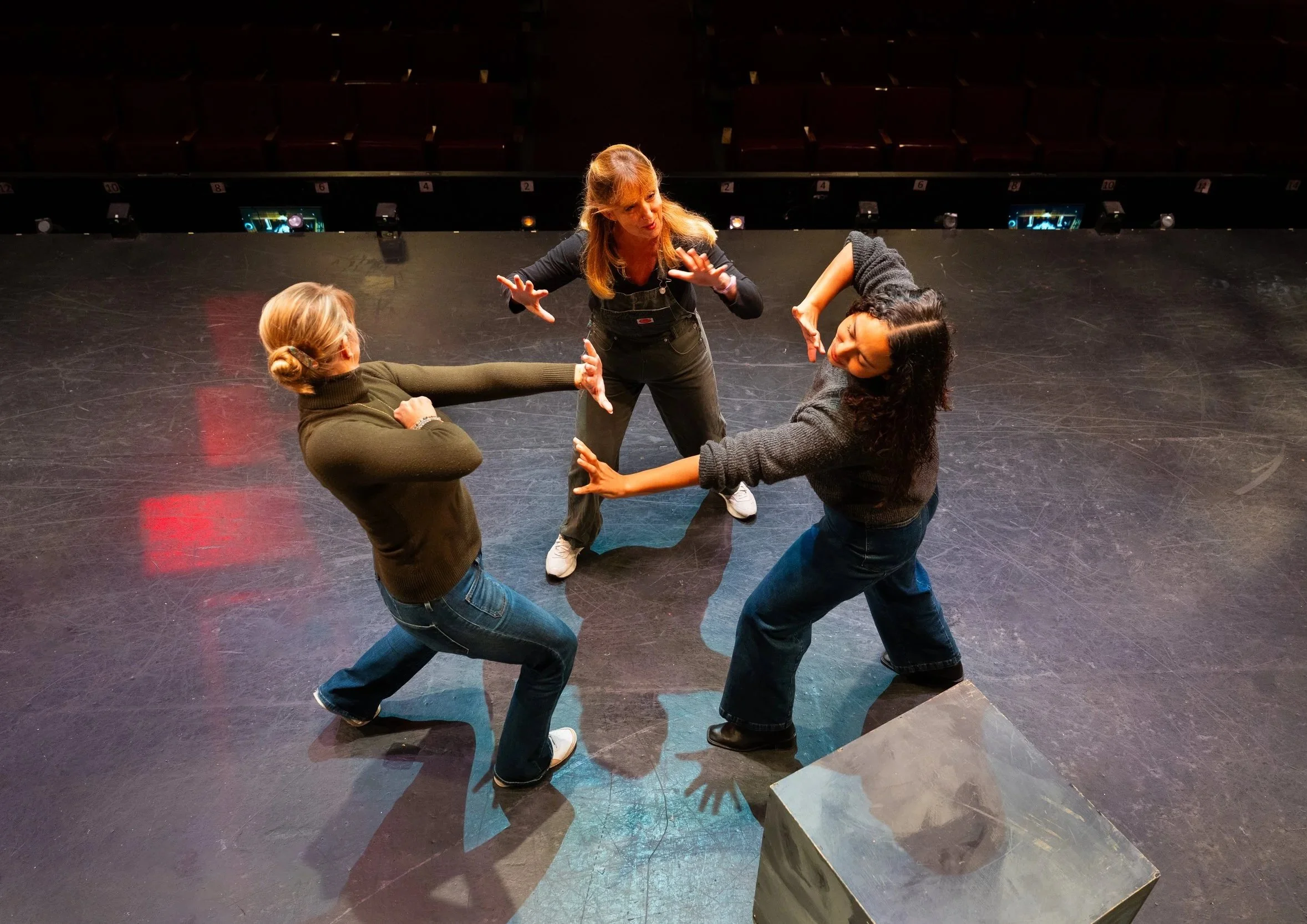 Elizabeth McKoy directing performers during a rehearsal.