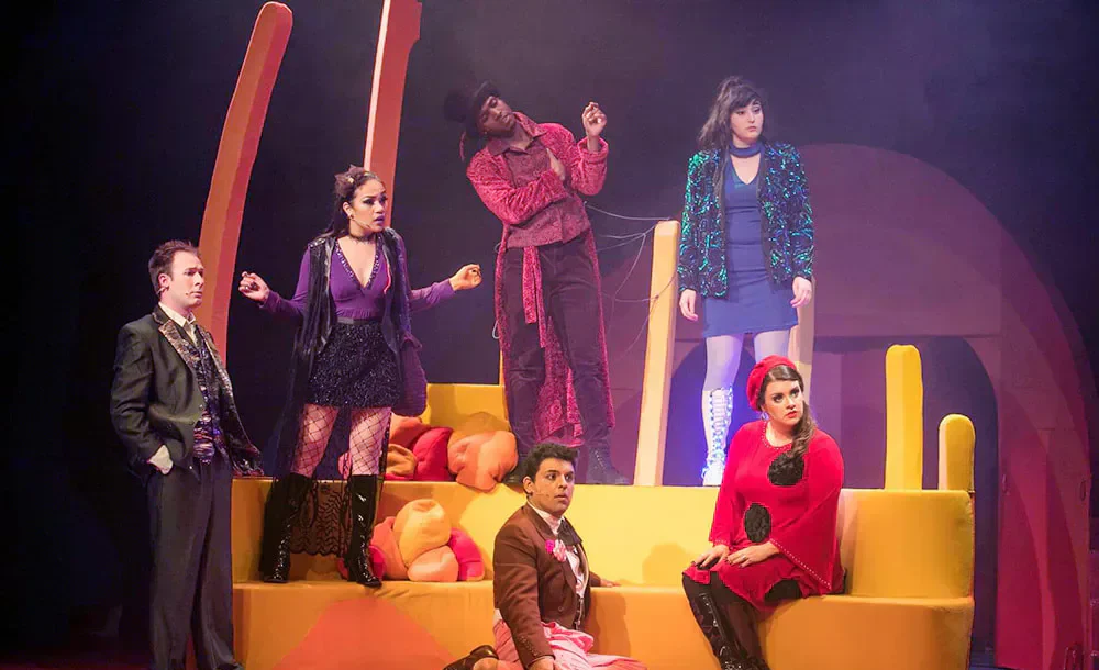 The insect ensemble posed across the colorful James and the Giant Peach set.