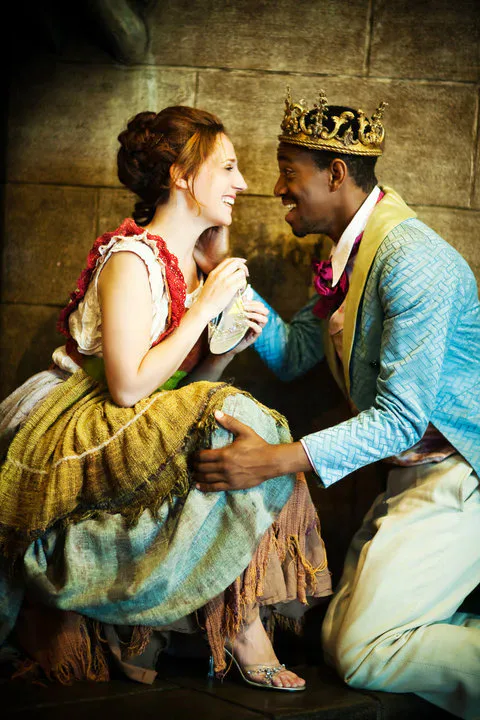 Cinderella and the Prince sharing a playful moment before her transformation.