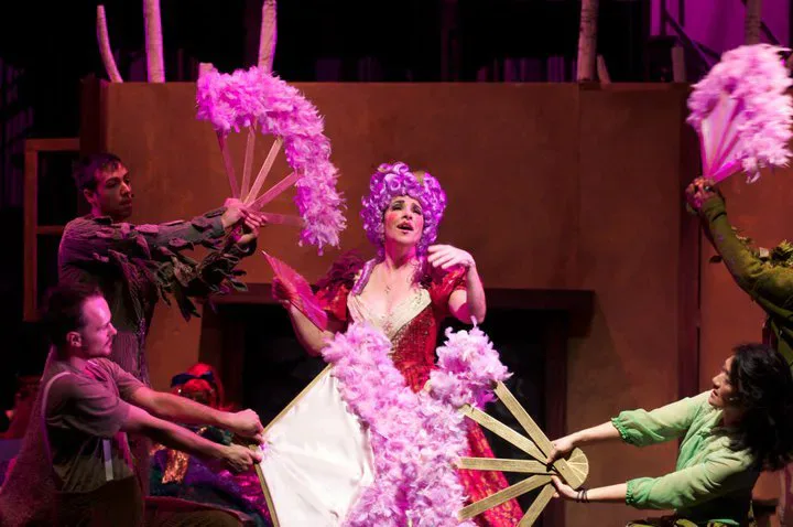 A theatrical feather-fan number showcasing Christine Crook’s vivid costume design.