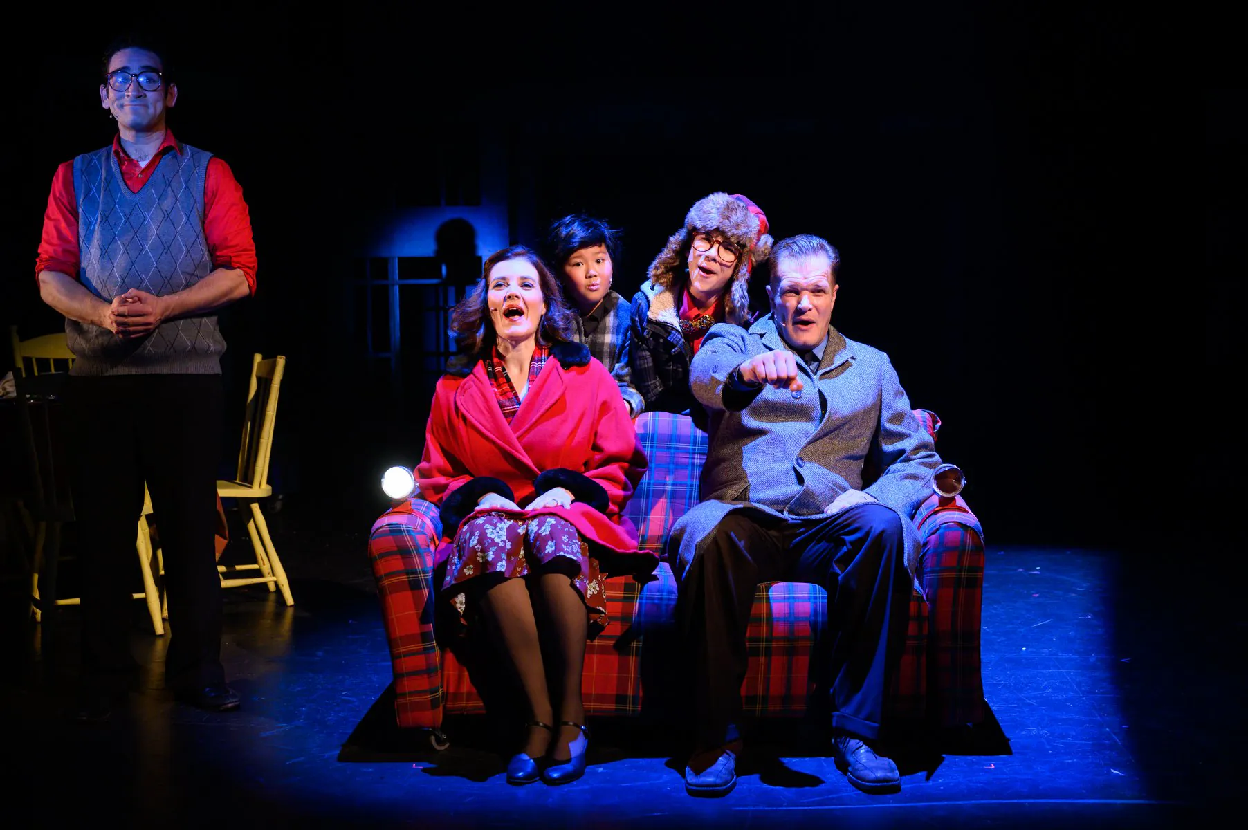 The Parker family gathered around their plaid living-room sofa.